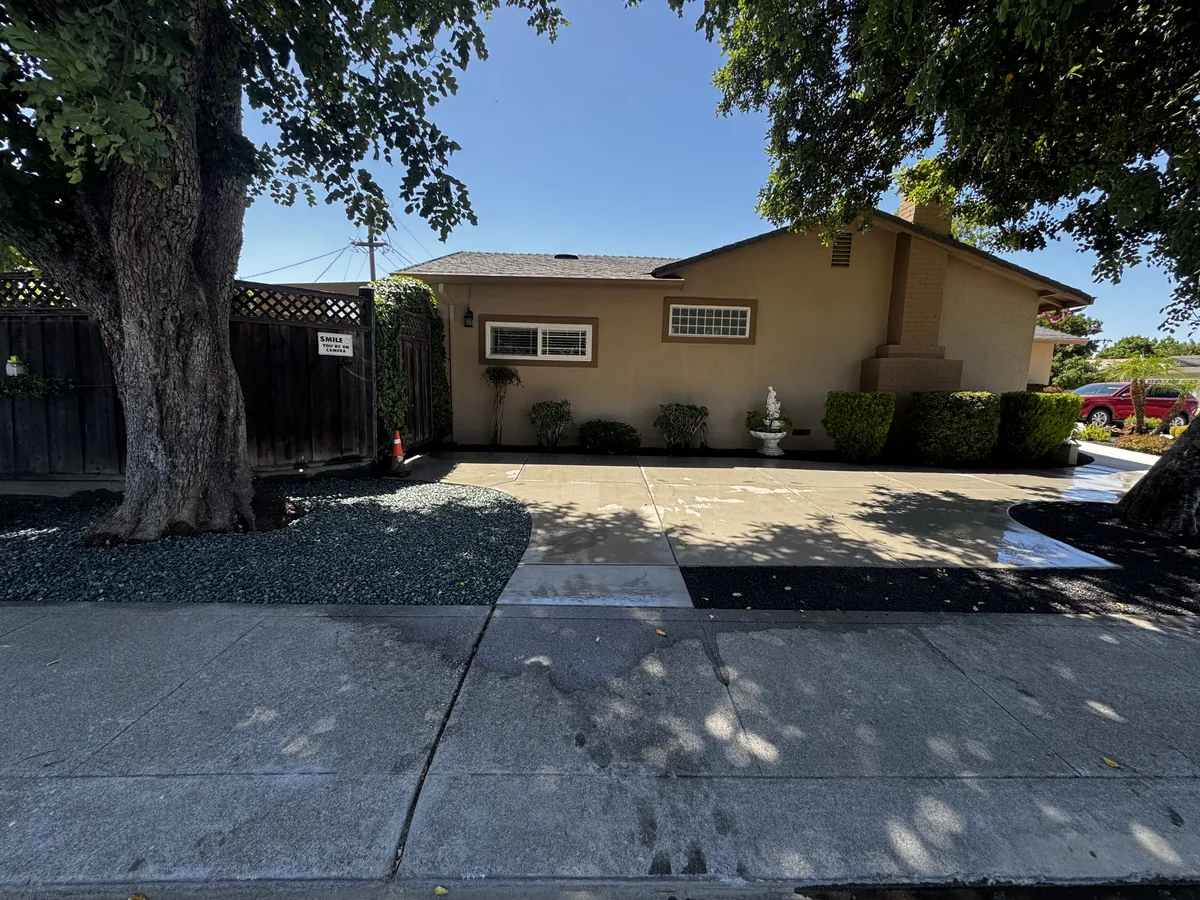 Concrete walkway with rock beds in Tracy, CA